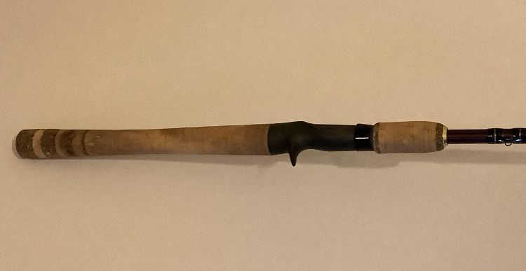 Cleaning cork fishing rod handle before photo